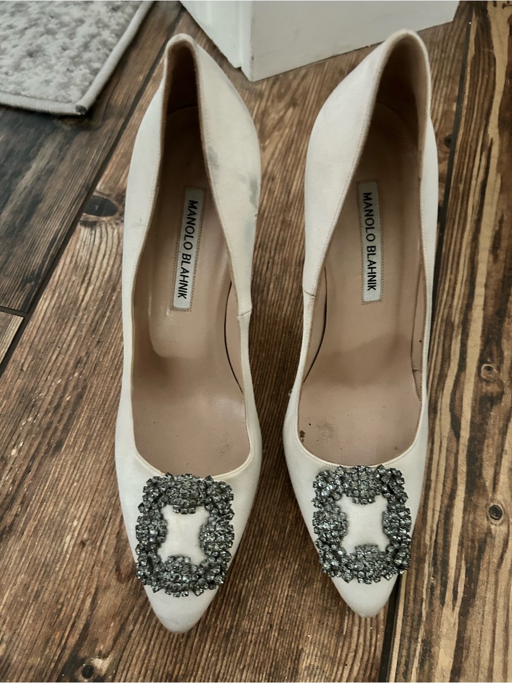 Manolo Blahnik Ivory Pointed Toe Pumps with Crystal Buckles